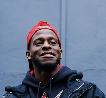 Man in red beanie smiling